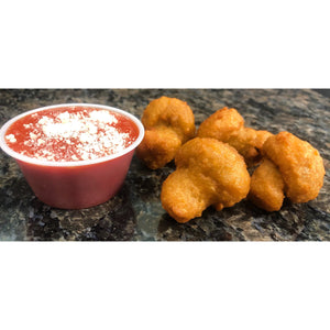 An image of breaded mushrooms. The mushrooms are coated in a crispy breadcrumb mixture and fried until golden brown. They are arranged on a plate, showcasing their appealing texture and color. The breaded mushrooms are served as a delicious appetizer, accompanied by a dipping sauce.