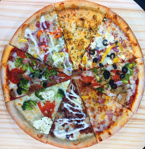 An image of a build-your-own pizza. The pizza has a thin crust with a variety of toppings available. The image shows a selection of ingredients including pepperoni, mushrooms, bell peppers, onions, olives, and cheese. There are also containers of different sauces and seasonings for customization. The build-your-own pizza offers endless possibilities for creating a personalized and delicious pizza.