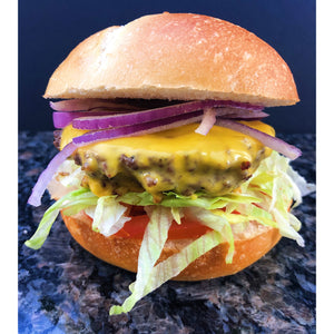  An image of an Angus hamburger. The burger is made with a juicy, thick Angus beef patty, grilled to perfection. It is served on a toasted bun and topped with melted cheese, lettuce, tomato, onion, and a tangy sauce. The burger is accompanied by a side of golden, crispy fries.